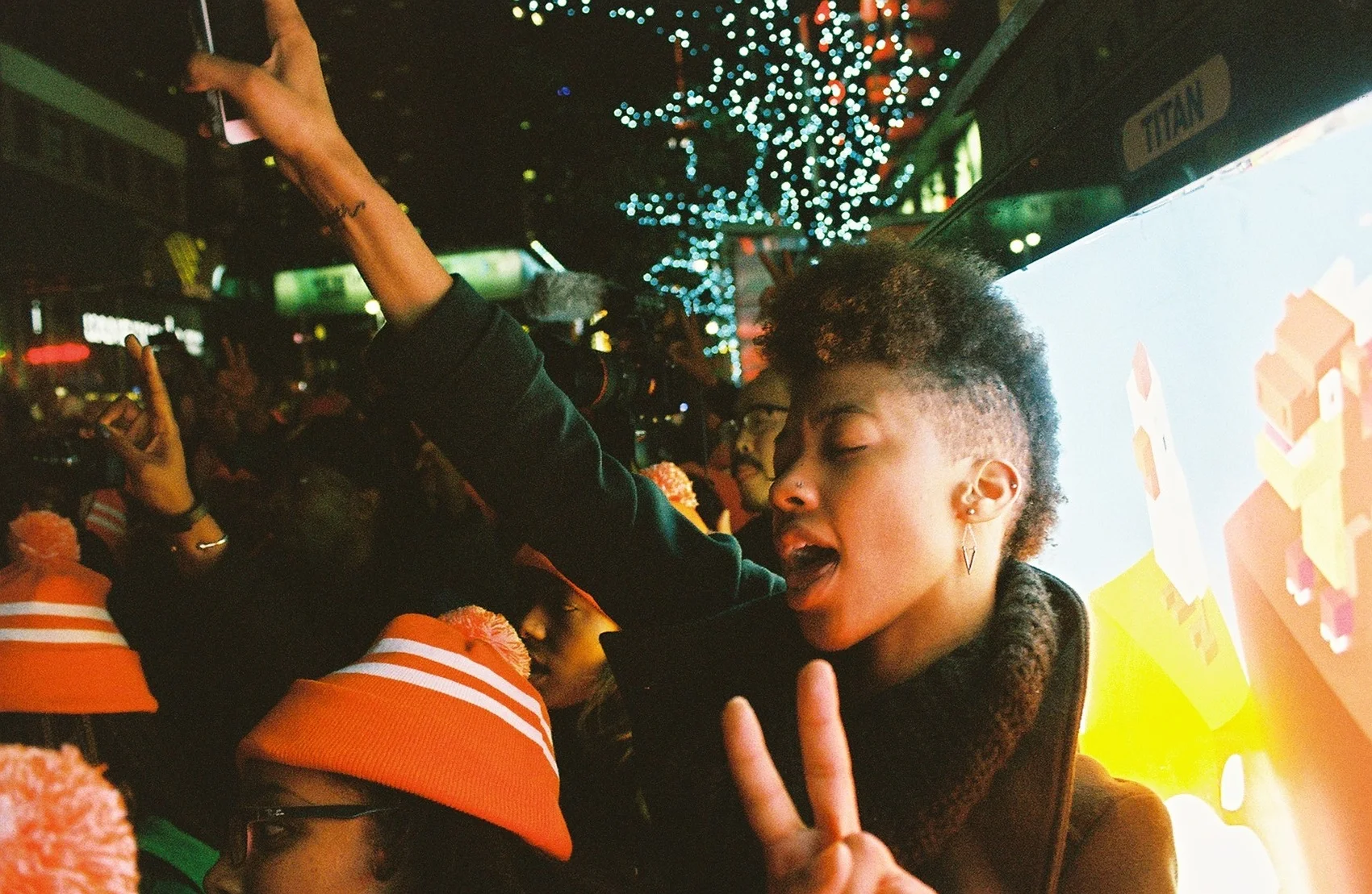  Marchers raise peace signs. 