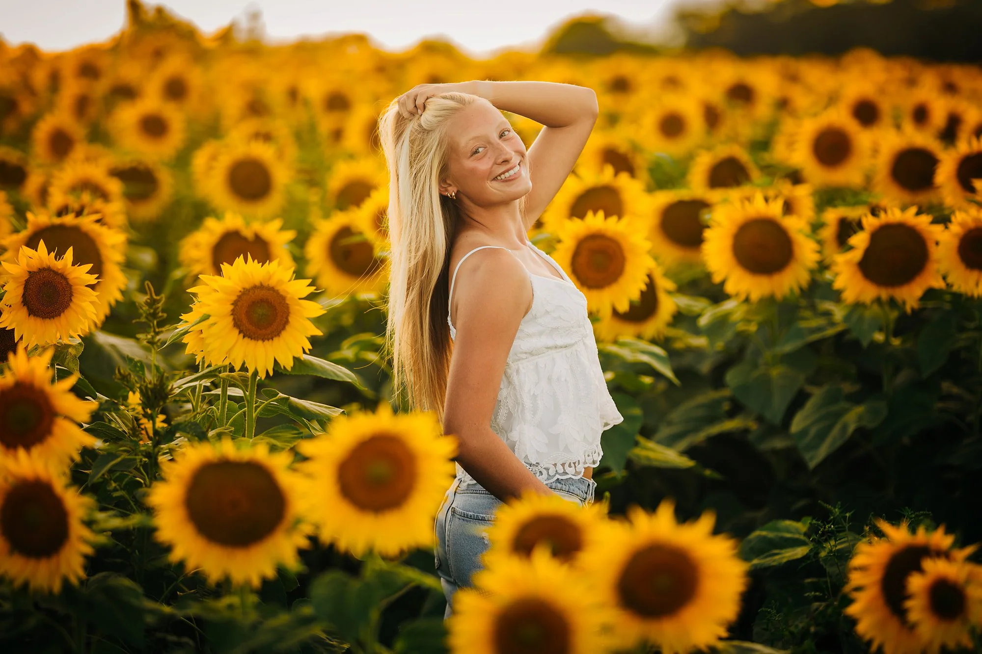 Kherington's senior portrait in a sunflower field during a summer session in the Lehigh Valley.