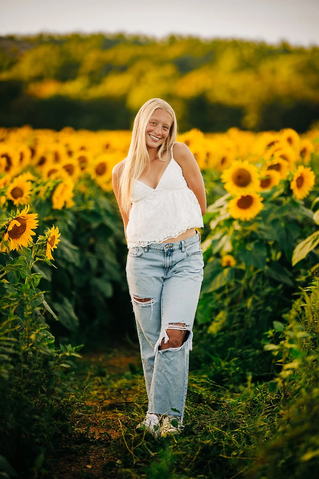 Kherington's senior portrait in a sunflower field during a summer session in the Lehigh Valley.