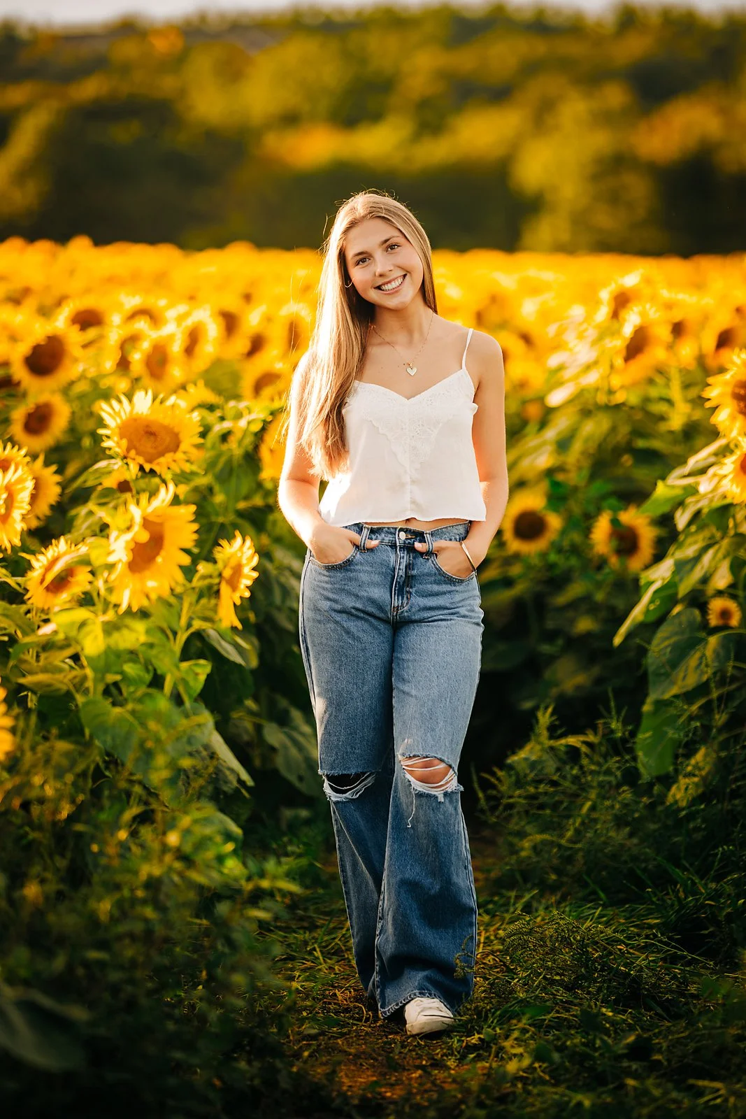 Amelia's senior portrait in a sunflower field during a summer session in the Lehigh Valley.