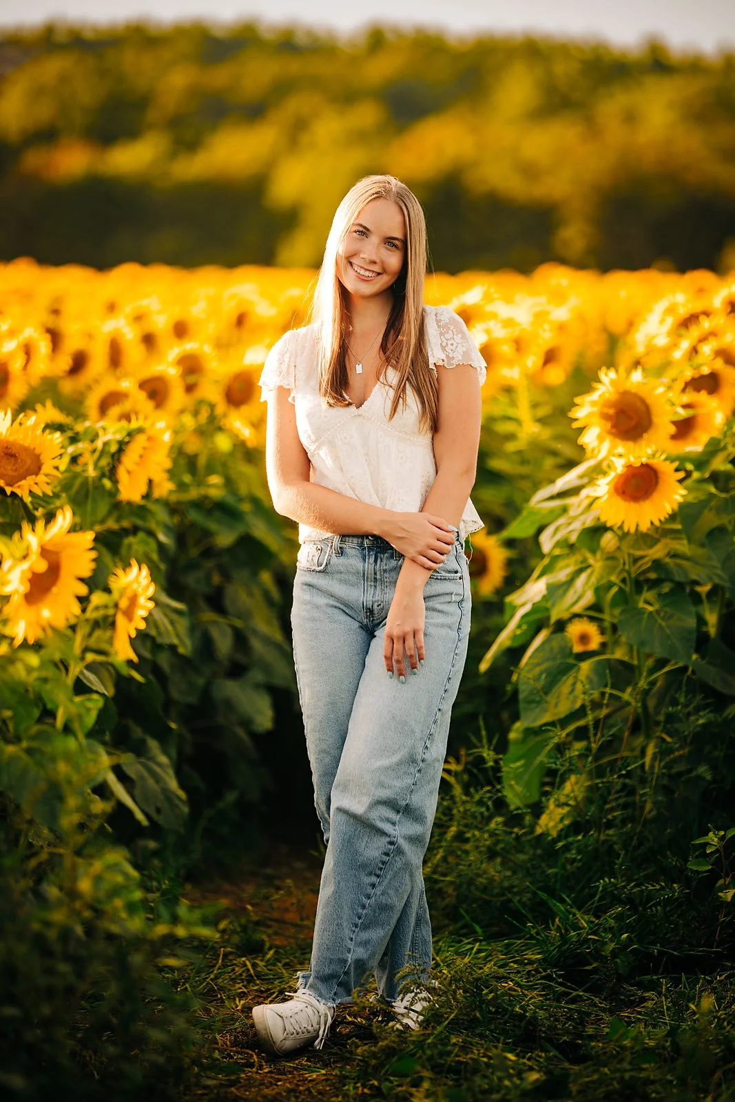 Grace's senior portrait in a sunflower field during a summer session in the Lehigh Valley.