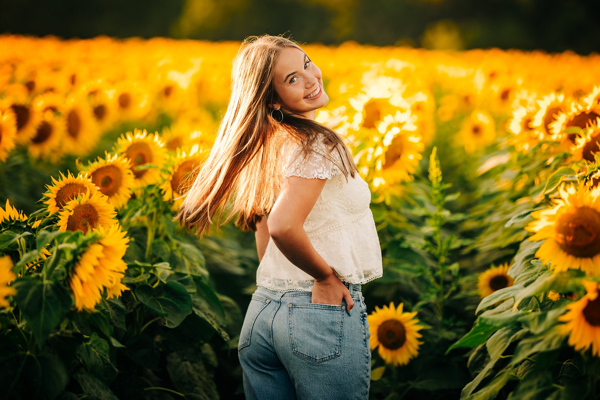 Grace's senior portrait in a sunflower field during a summer session in the Lehigh Valley.