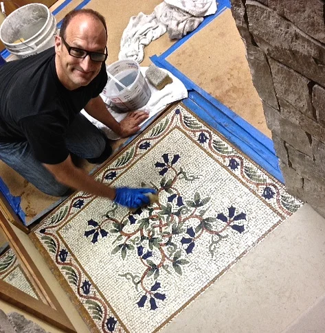 Me installing Floral Vine floor mosaic.jpg