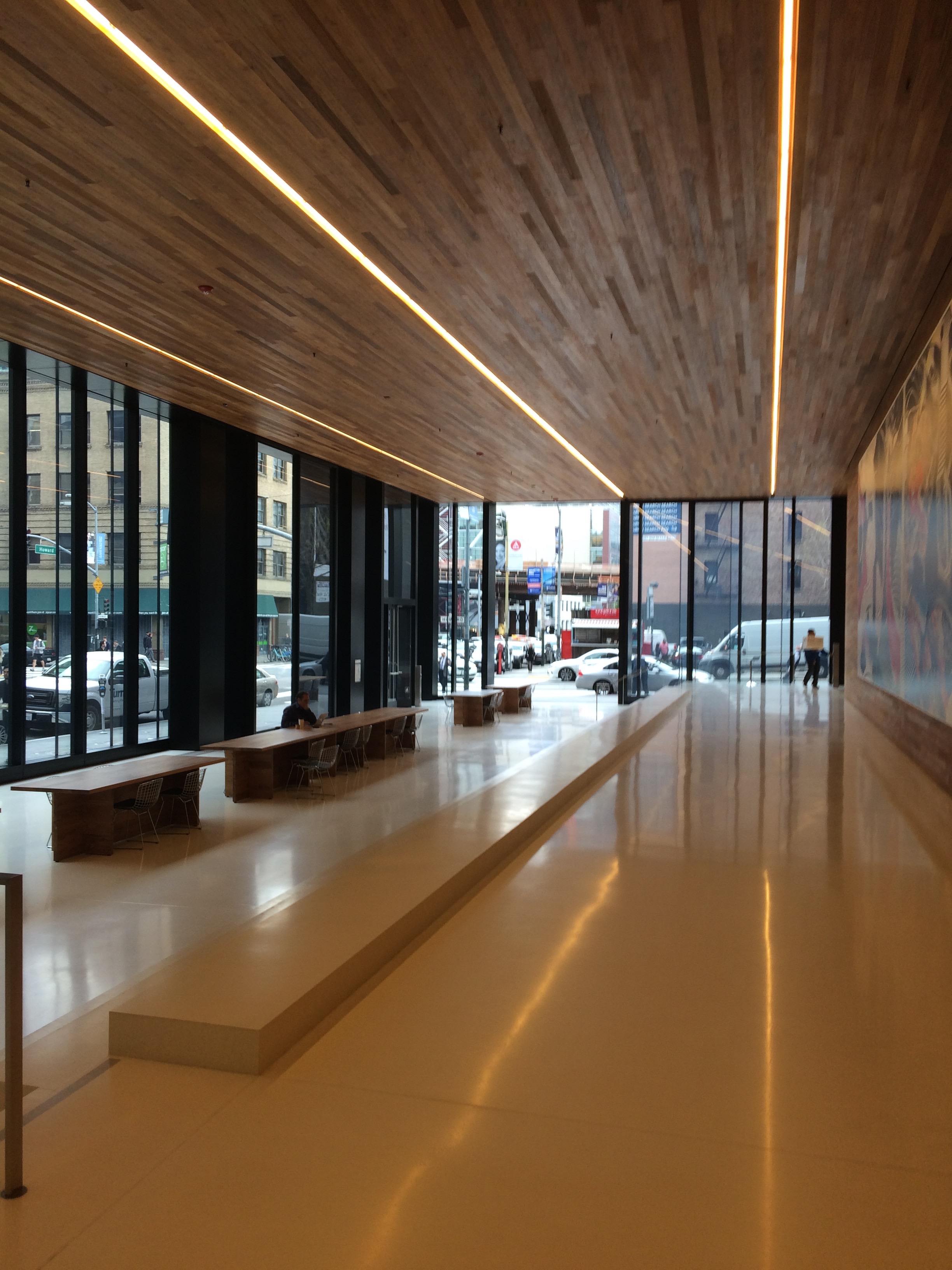 the building has a massive open public space with tables chairs and lots of fresh air!