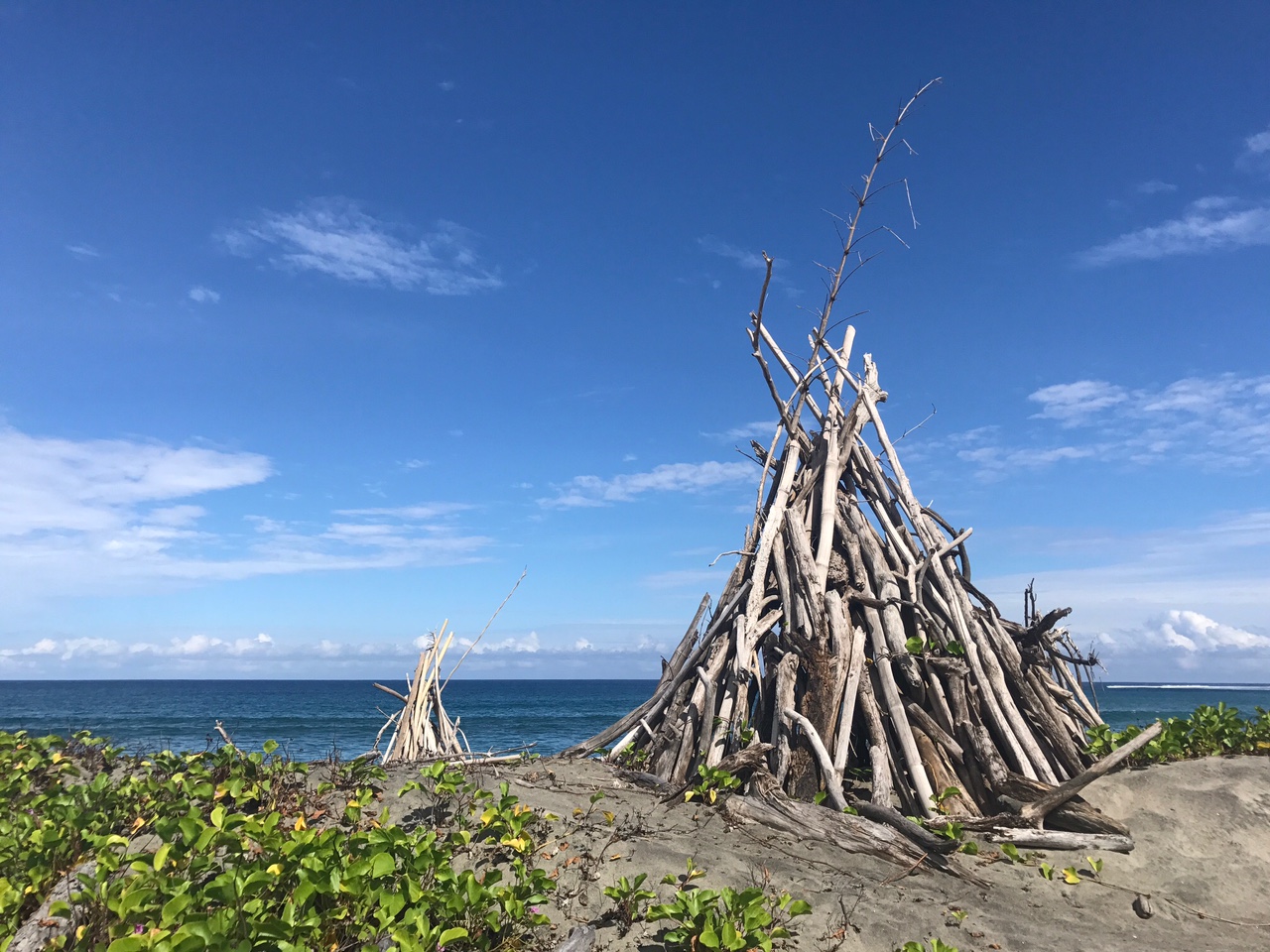 Driftwood teepees on the beach. Currently looking for a roommate! ;) 