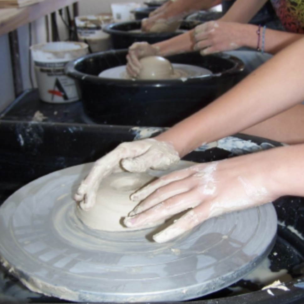 Hands on wheel.Pottery Class Shot.png