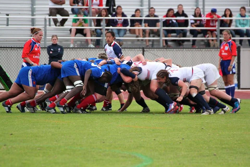 Scrum during the USA-France series in California. (That's me standing by the scrum. I'm a scrumhalf, which basically means I'm the little one, who yells at the big ones, pictured here beating the crap out of each other.)
