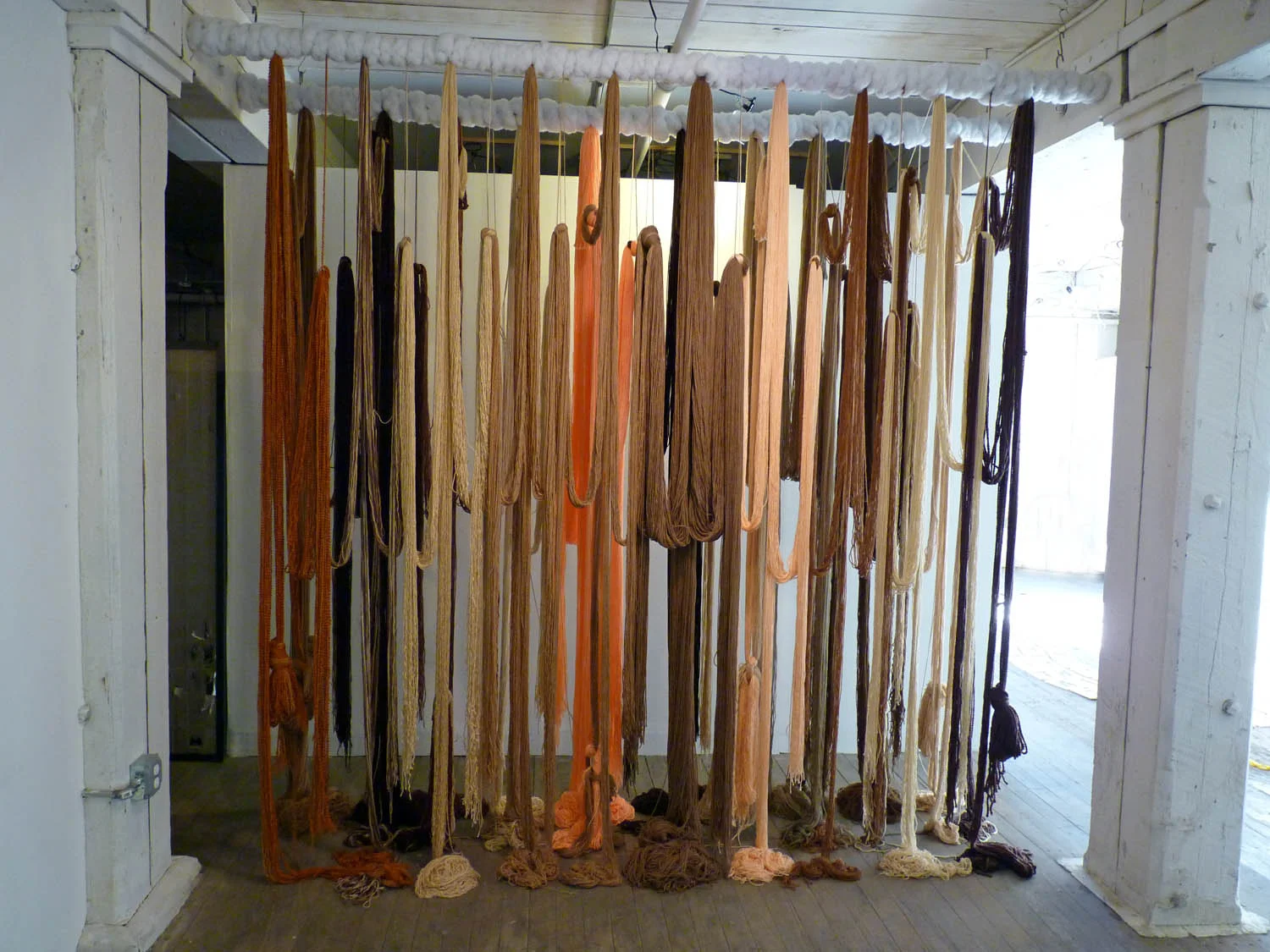 A Valence, 2012, Yarn, wood, poly-fil and hardware, 10 x 2 x 10 feet