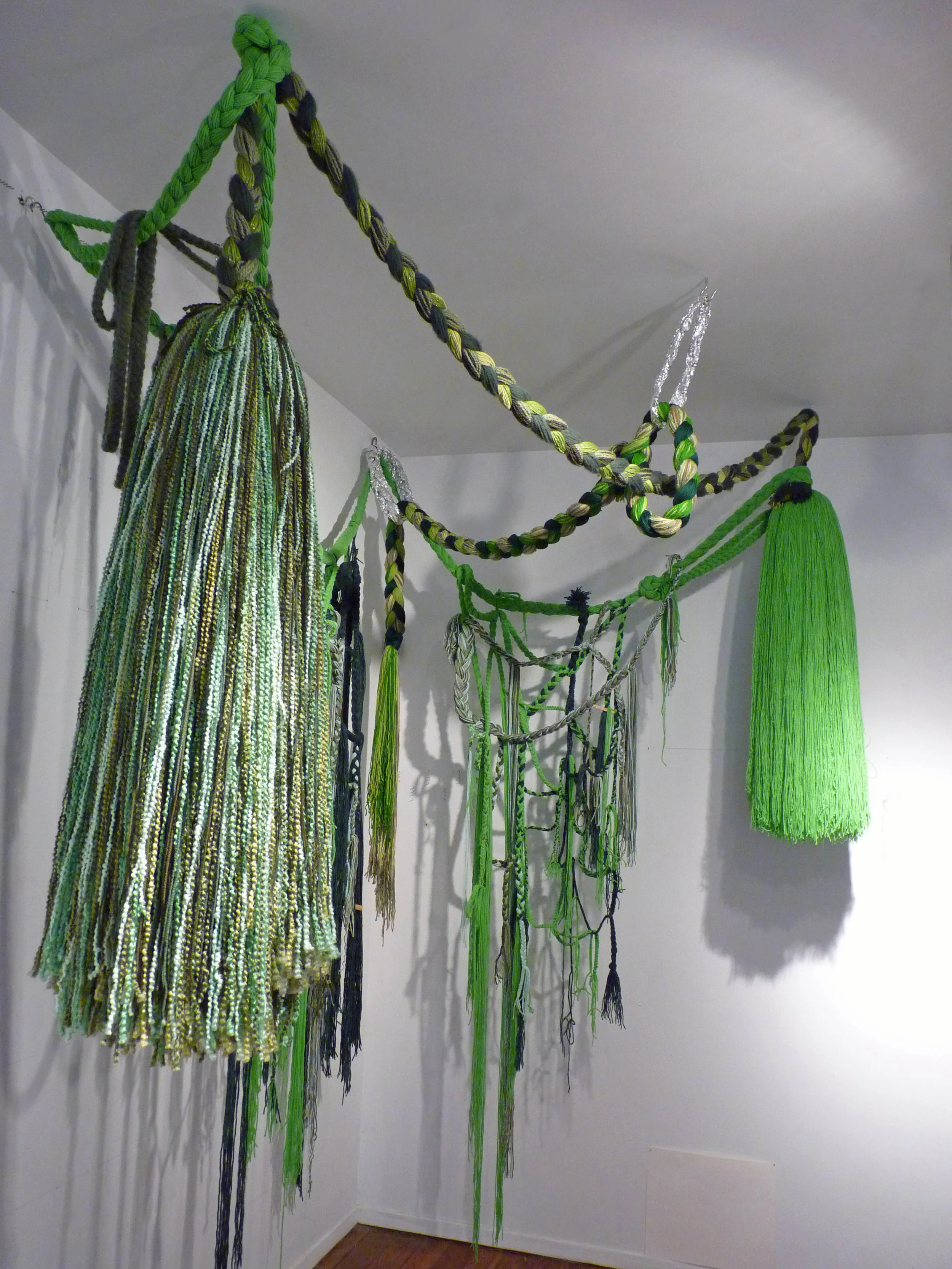 Green Piece, 2011, Acrylic yarn and tin foil, 7' x 8' x 9' (Studio view)