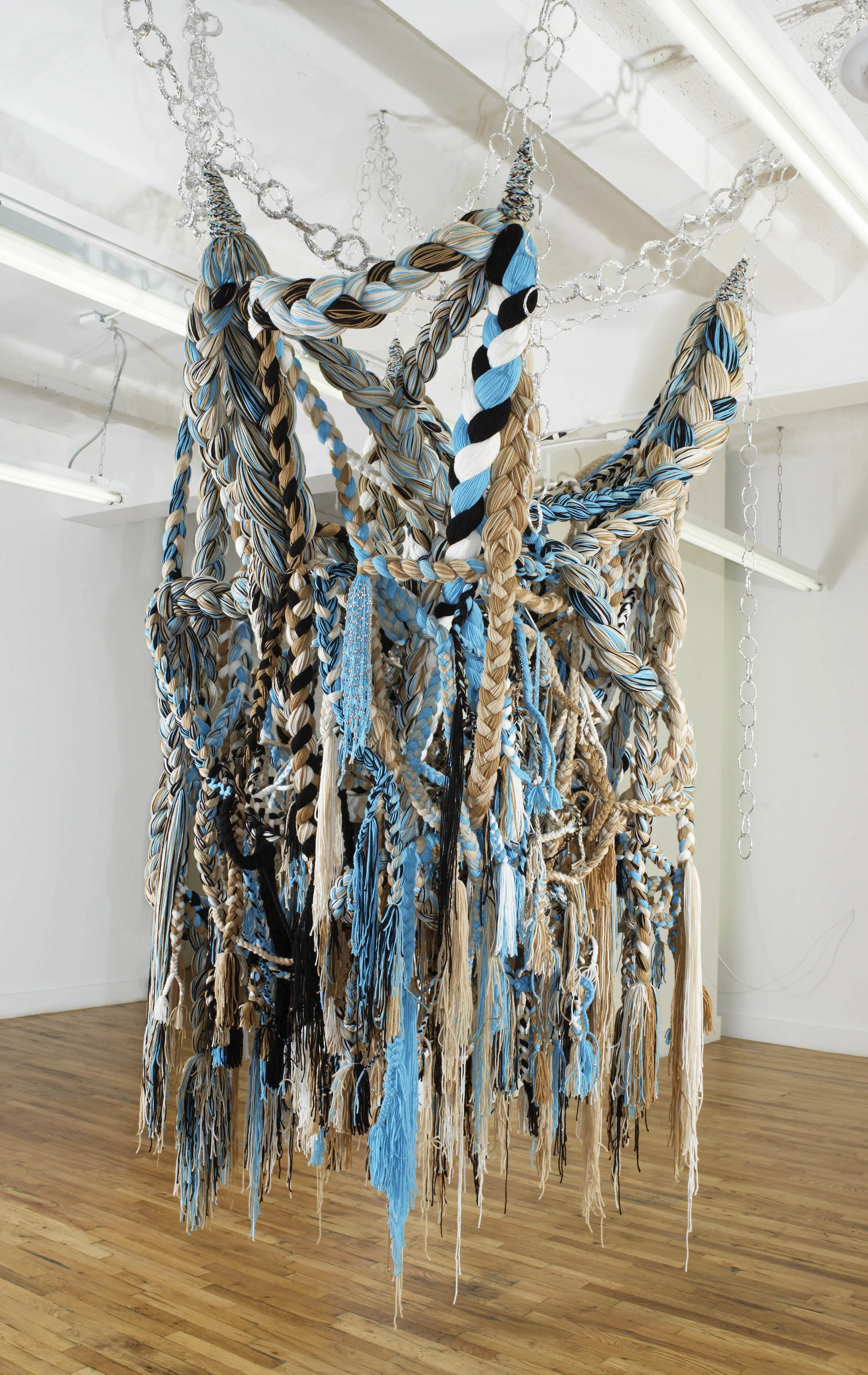 SQUASHblossom, 2007, Acrylic yarn, beads, tin foil, 5 x 6 x 7' (Installation)