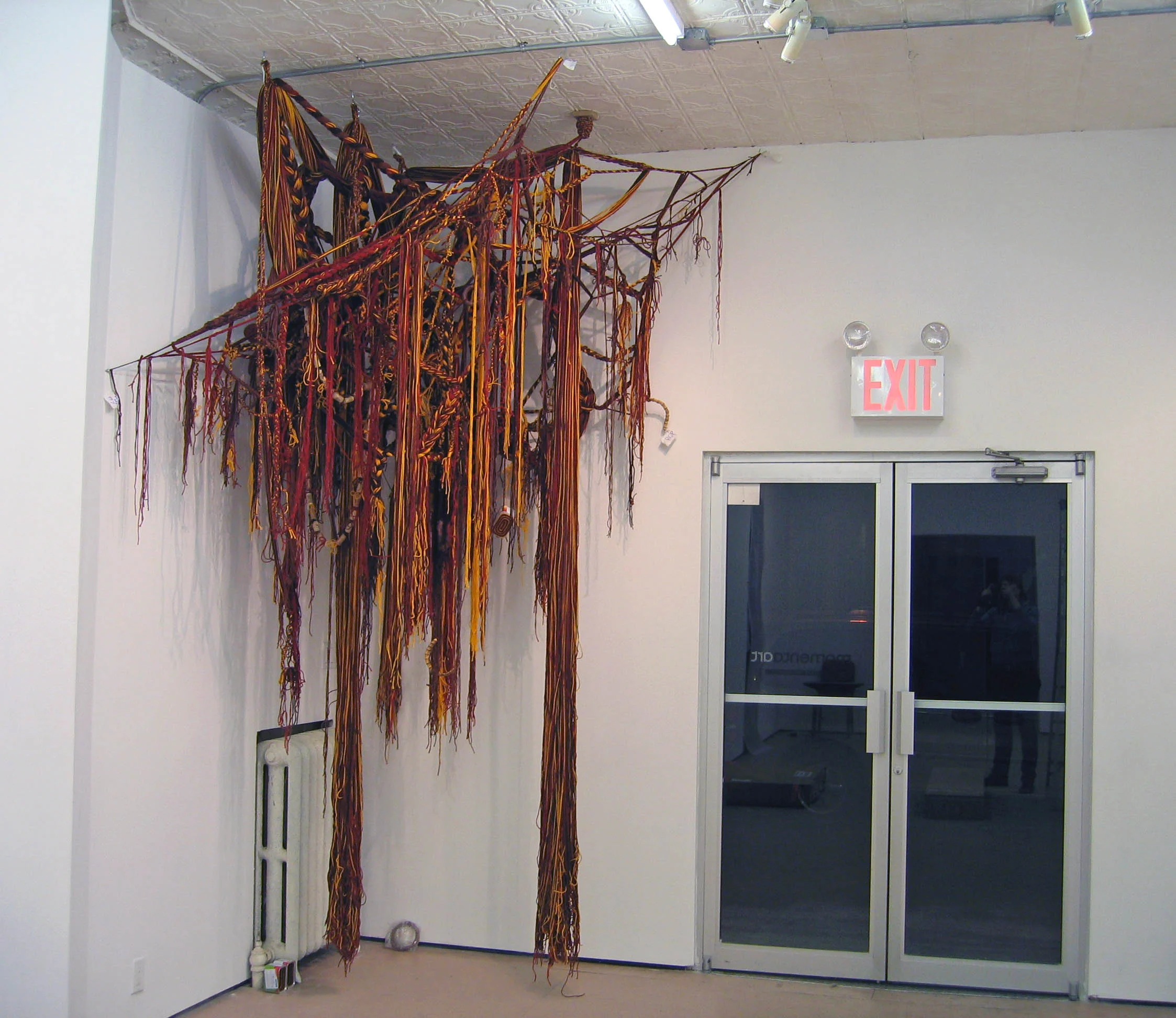 Indian Corn, 2007, Acrylic yarn, clay, cork, fabric, bamboo and cans, 7 x 6 x 11' (Installation)