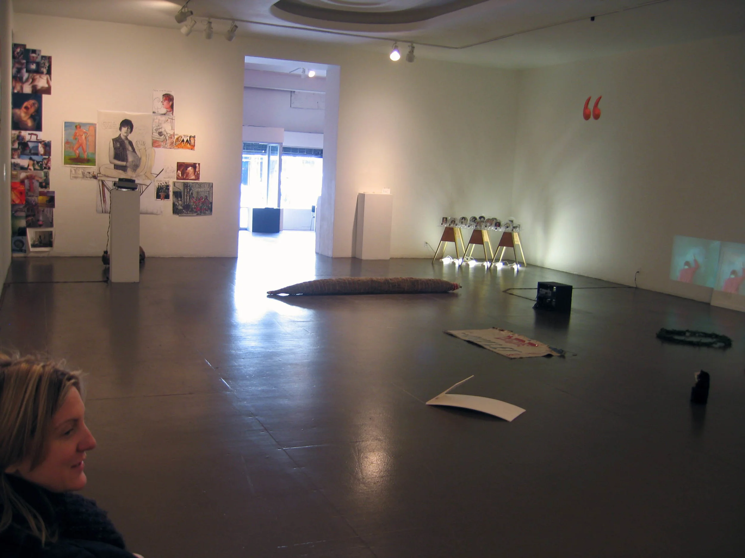 First Love (Installation view at Shared Women LACE), 2007, Glass, paper, tape, plexiglass, wood and fluorescent lights 41 cups with president, 41 saucers with first lady, 4 x 3 x 3'