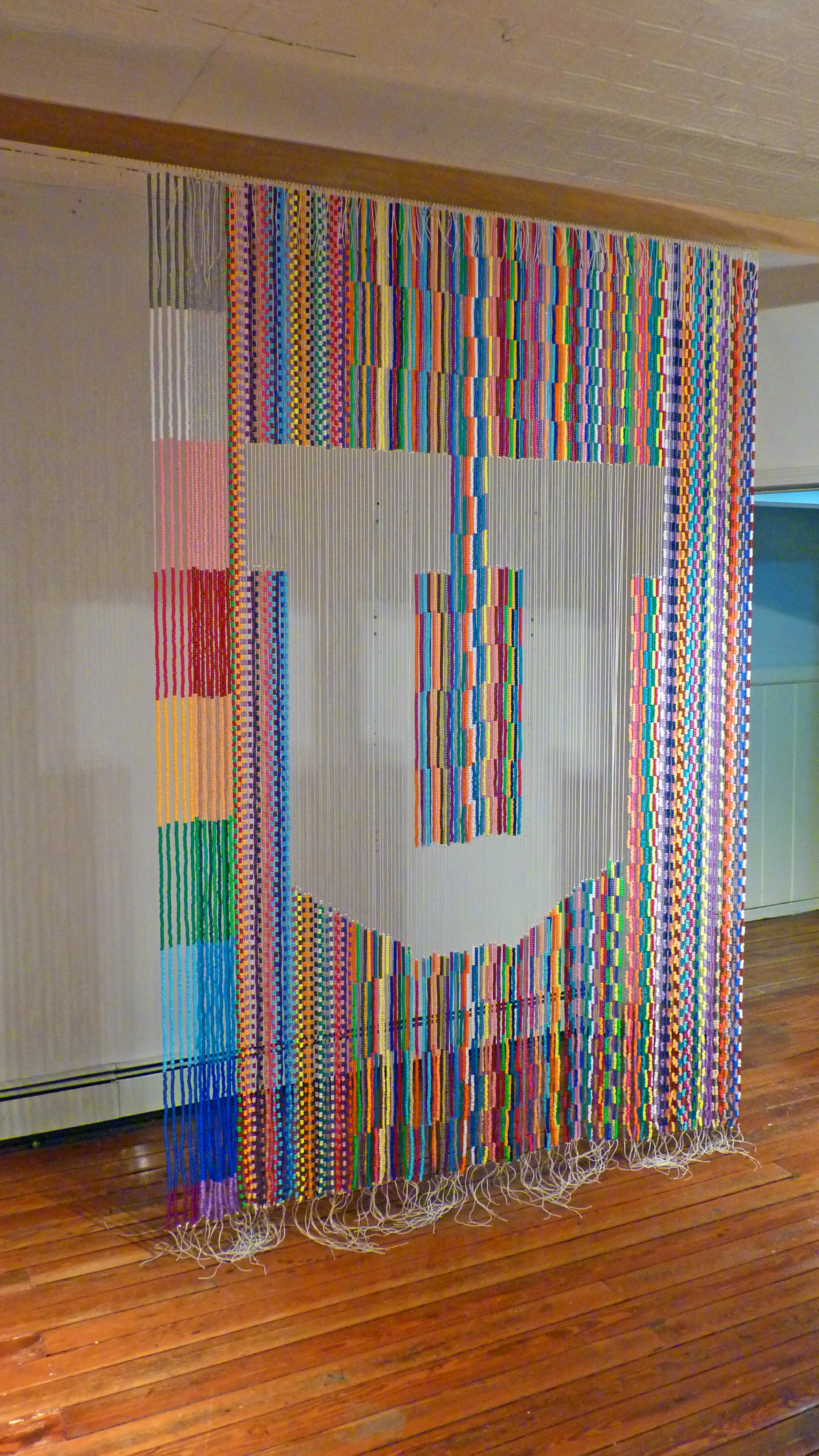 Untitled (The Big "U"), 2009, Plastic beads, nylon, metal and wood, 6' x 8'