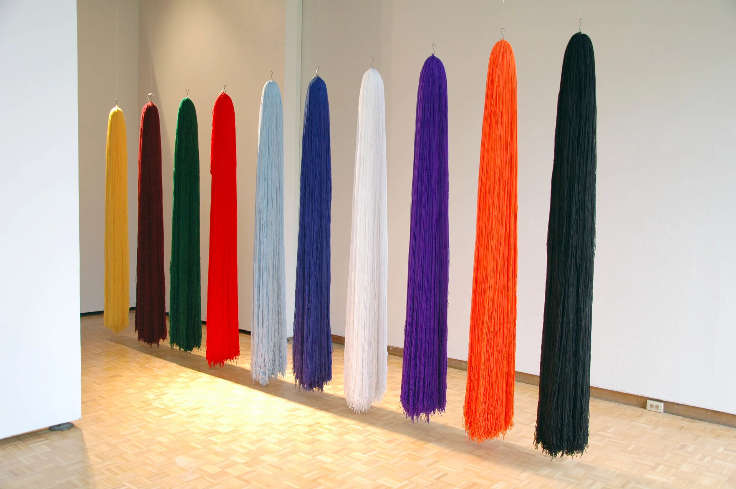 Untitled (Varsity), 2008, 10 Acrylic yarn tassels, 12" x 72" each (Installation)