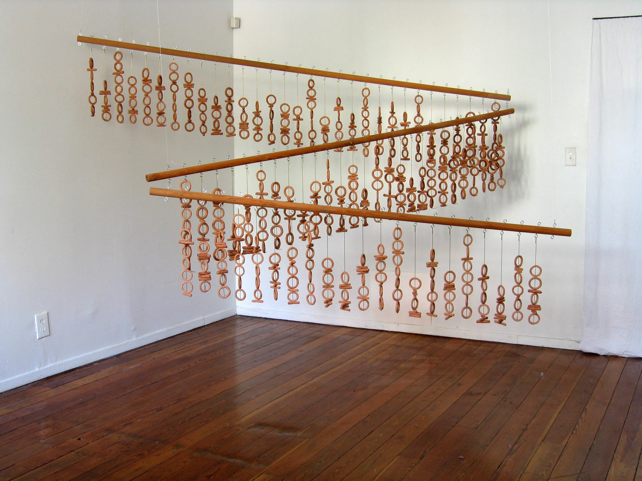 "In the beginning was the Word..." (Binary Triptych), 2001, Clay, metal and wood, 1 1/2 x 6 feet, 1 1/2 x 7 feet, 1 1/2 x 8 feet