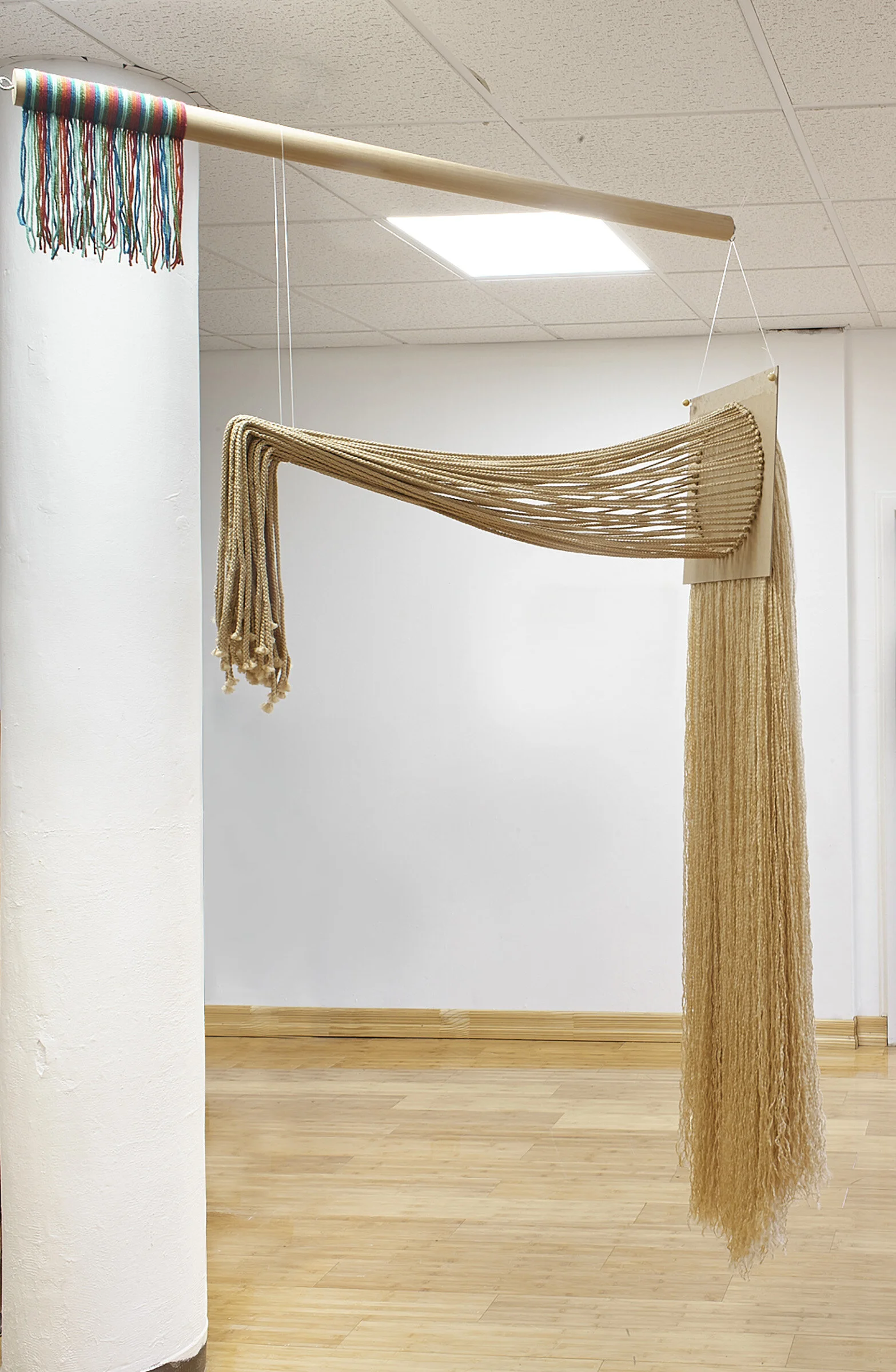 Imitation Fearless Girl, 2019, Polypropylene cord, wood, cardboard, yarn, fishing line, and hardware, 48” x 22” x 84”