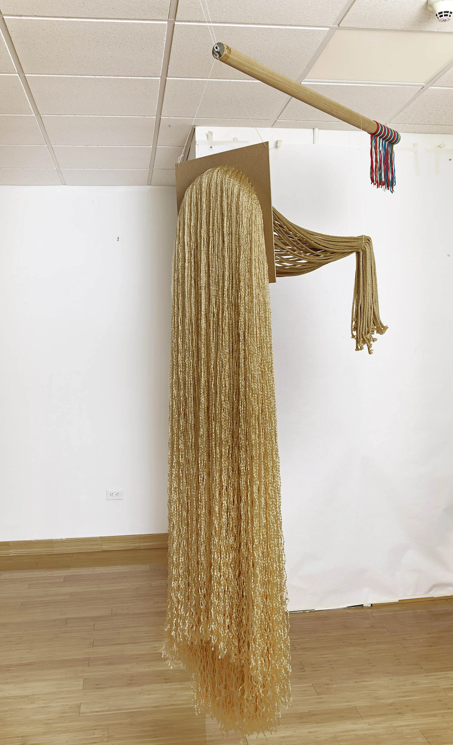 Imitation Fearless Girl, 2019, Polypropylene cord, wood, cardboard, yarn, fishing line, and hardware, 48” x 22” x 84”