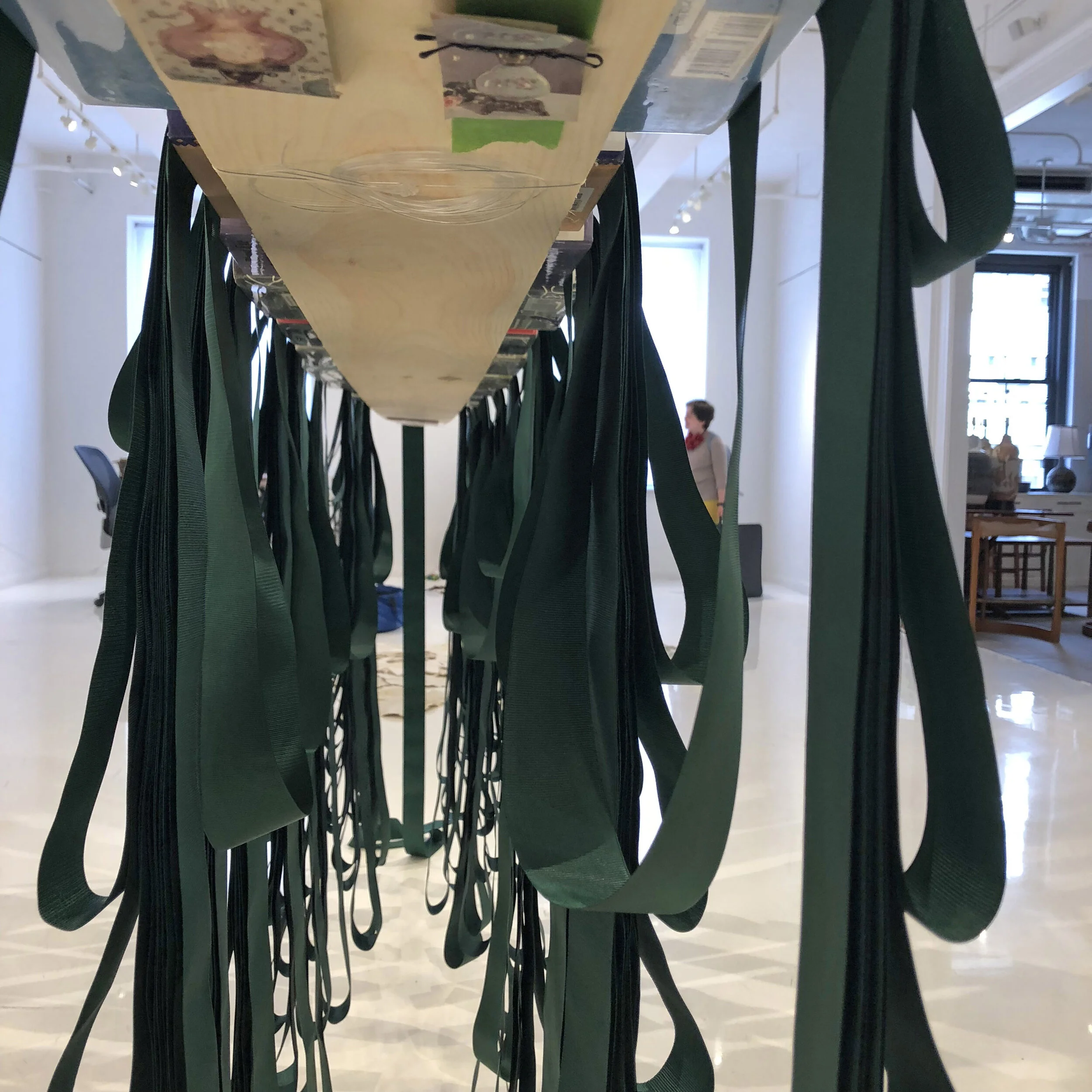 Bookmark (detail), 2018, 13 Library books, wood, metal, yarn, clippings, tape, and one long-continuous grosgrain ribbon bookmark, 8’ x 6” x 8’