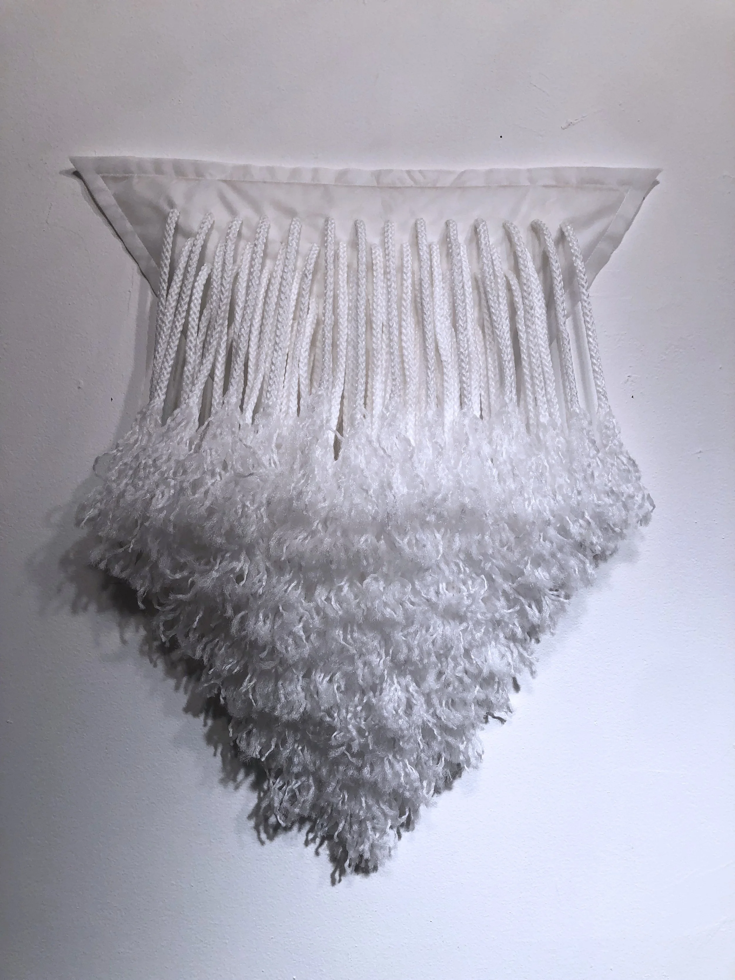 Ellie Murphy, White Triangle, 2022, Macrame and non-woven fiber, 20" x 25" x 5"