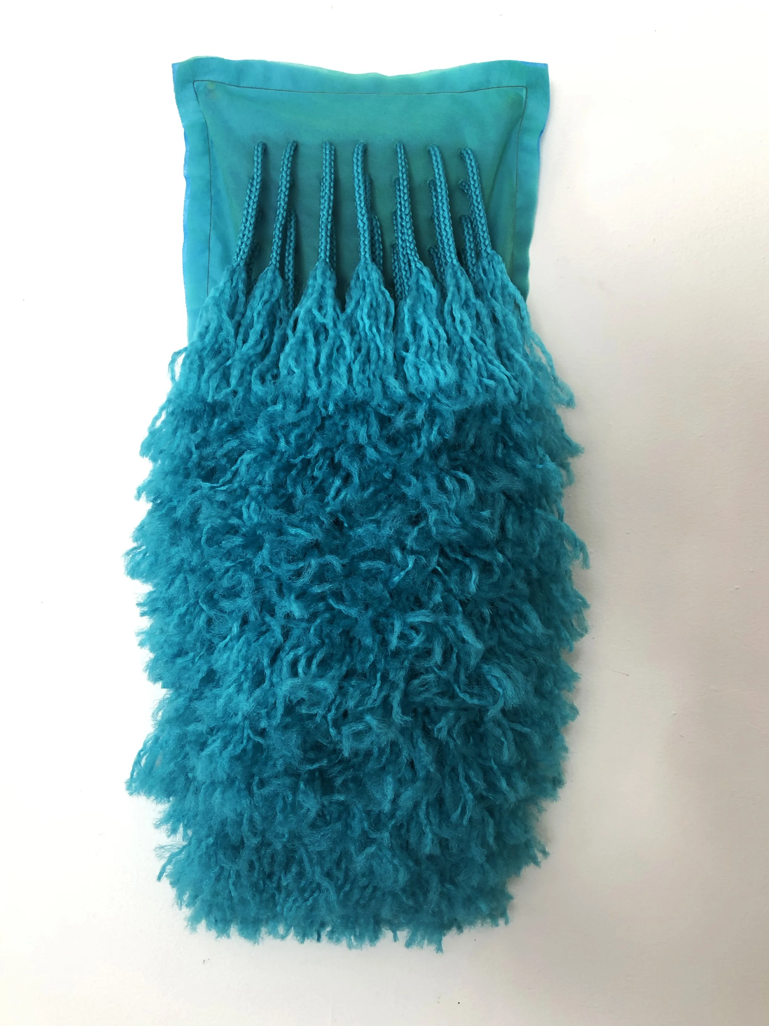 Ellie Murphy, Blue-Green Beard, 2022, Macrame and non-woven fiber, 13" x 25" x 5"