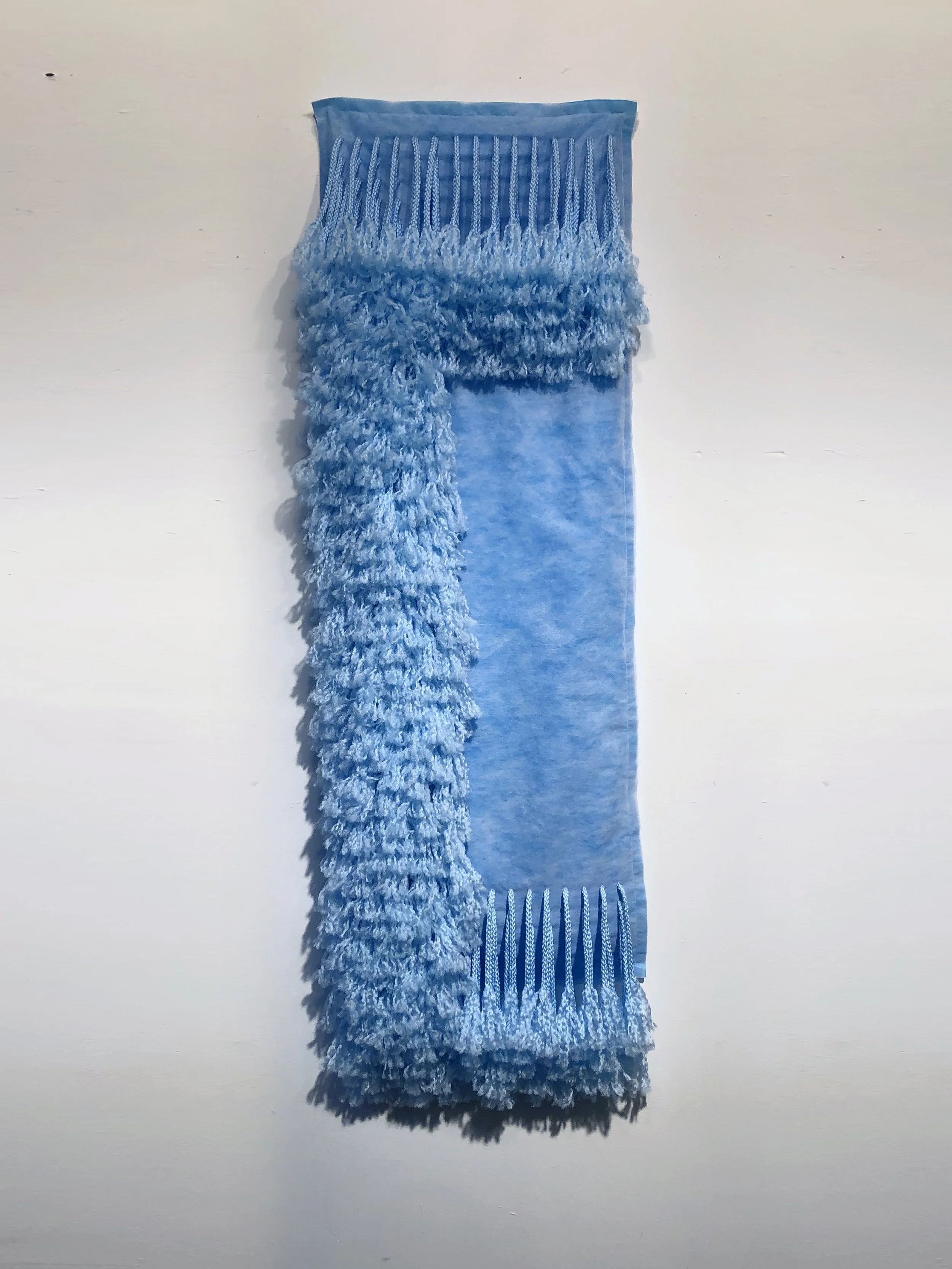 Ellie Murphy, Sky Blue C, 2022, Macrame and non-woven fiber, 17" x 55" x 5"