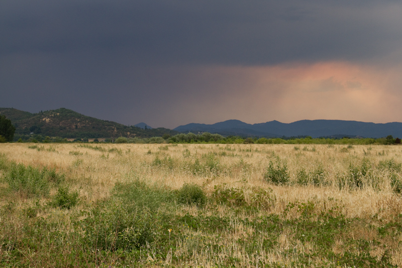 The red haze in the sky is a result of forest fires in the area
