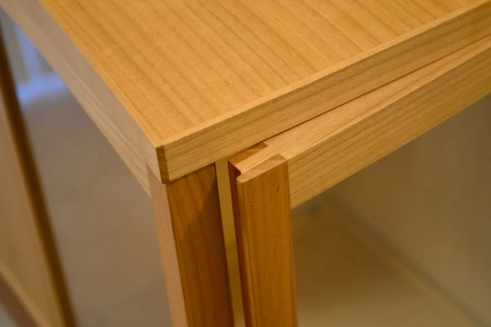   This is a fun detail...placing a small lip on the edge of the door and  putting a groove in the post in which the door rest against. This  eliminates a seem in which light can pass through from the front glass.  