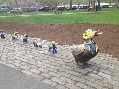 Duck statues at the park wearing Boston Marathon Easter Bonnets