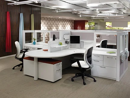 Xsite panel system with Footprint worksurfaces and storage, and Wish seating
