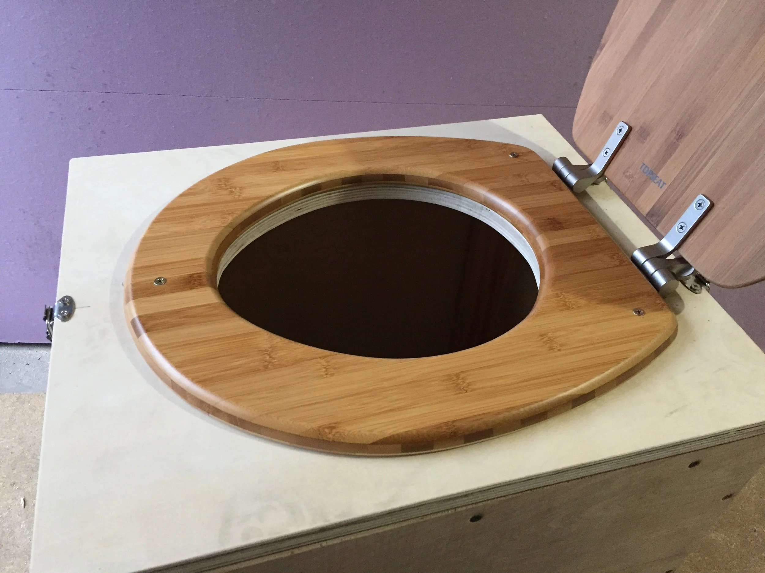 On goes the toilet seat.