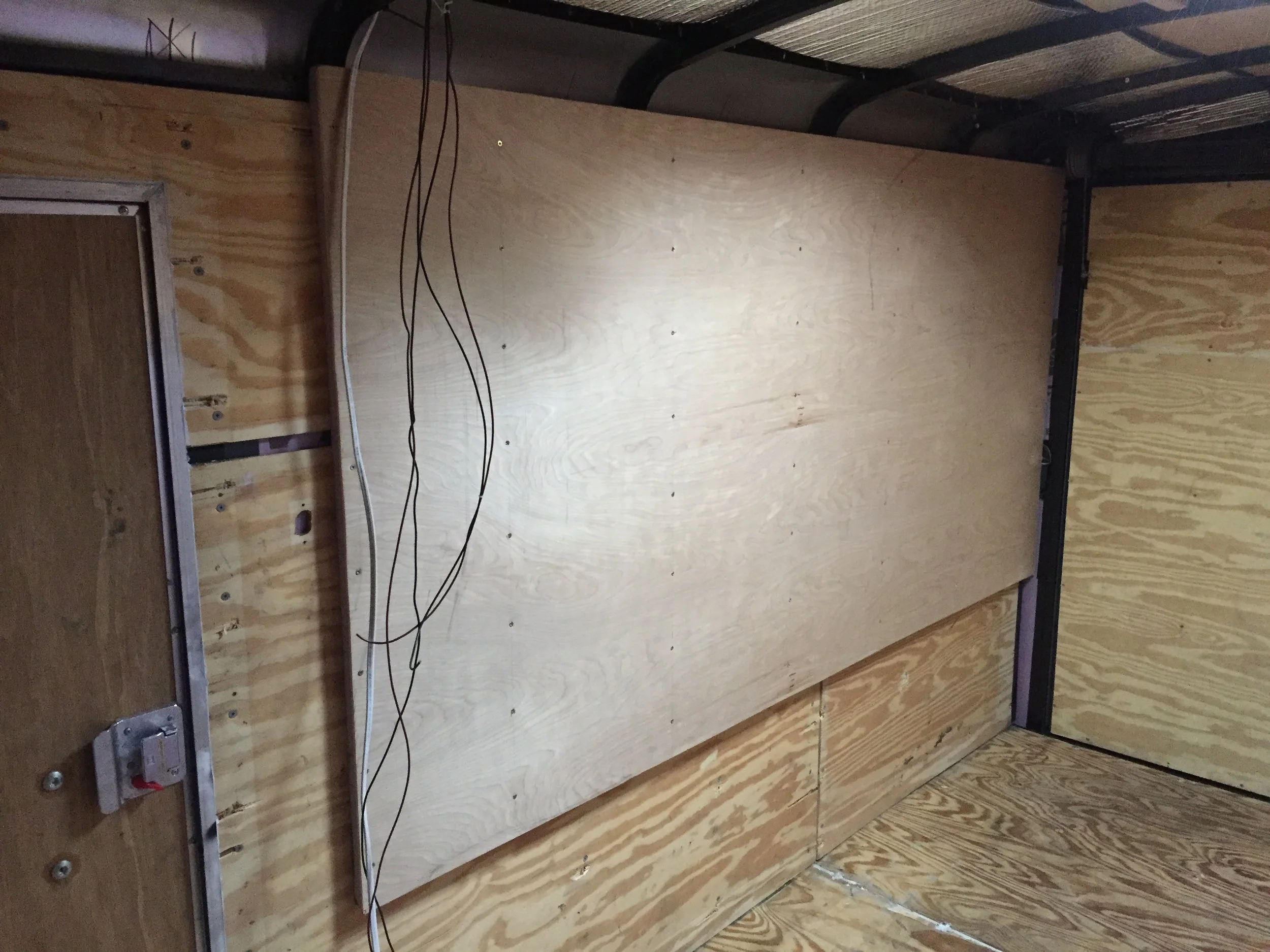 Then screwed in the 1/4" paneling on top, sandwiching the insulation.