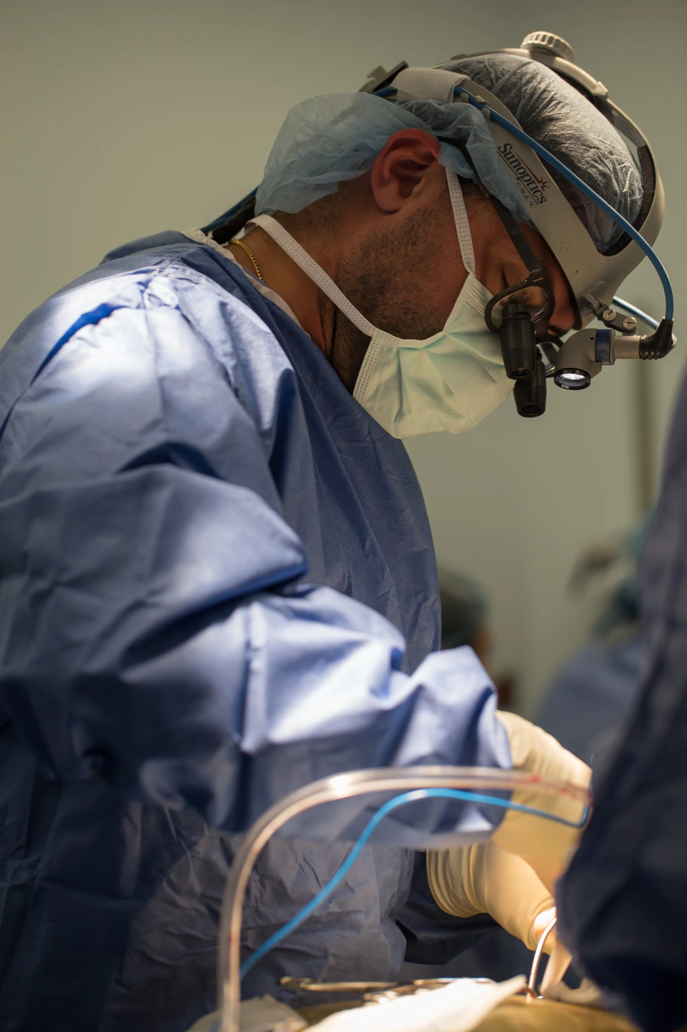  A surgeon performs a procedure to relieve pressure in a patient's spine.&nbsp; 