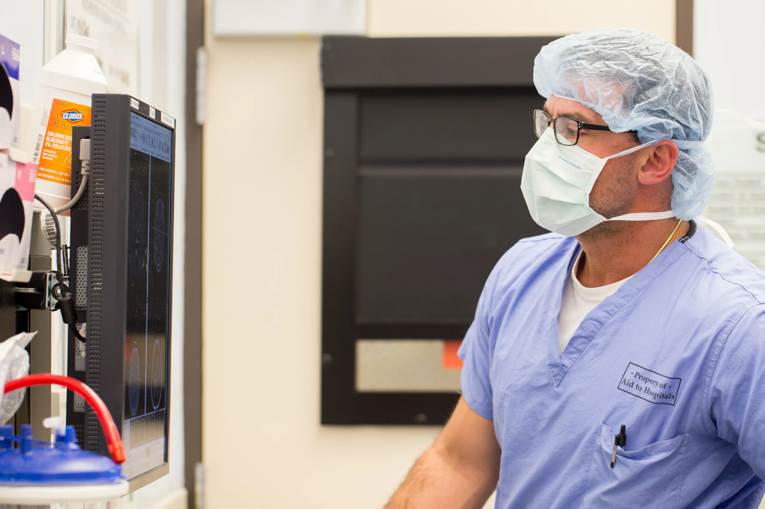  A surgeon inspects a patient's MRI before a brain procedure.&nbsp; 
