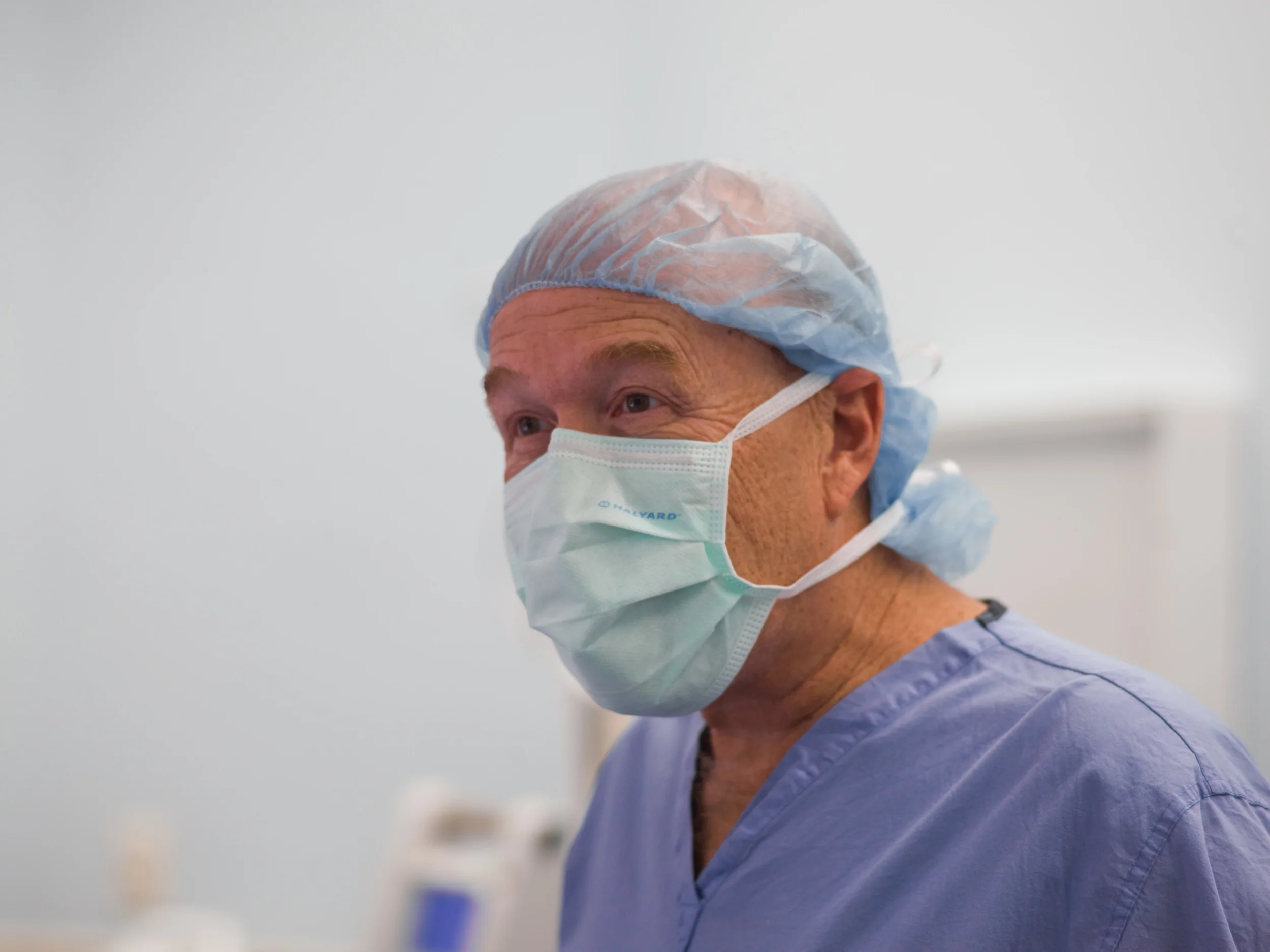  A surgeon laughs at a joke after the procedure is completed.&nbsp; 