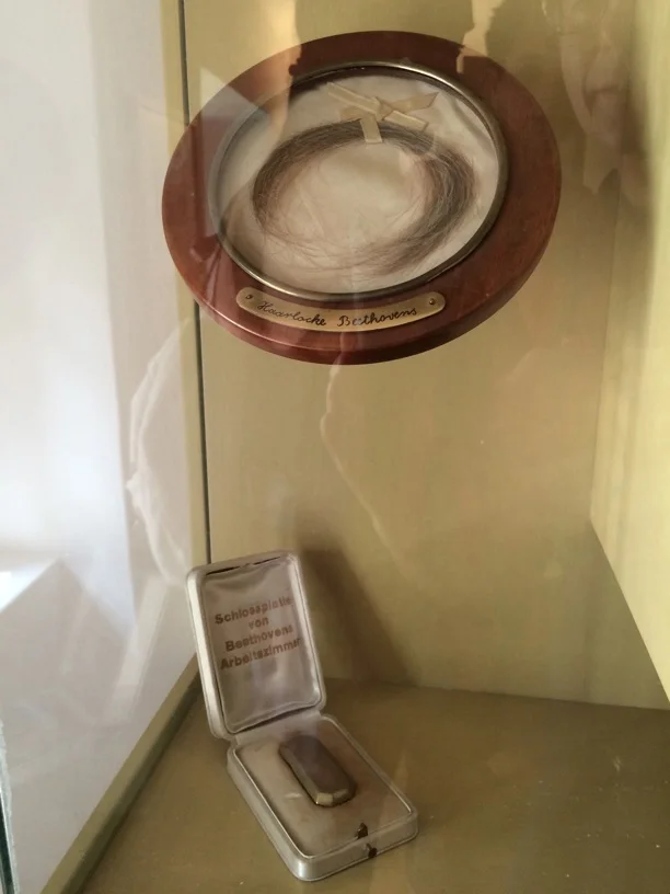 Bizarre relics in the Heiligenstadt museum—a lock of Beethoven's hair and the lock plate from his work study.