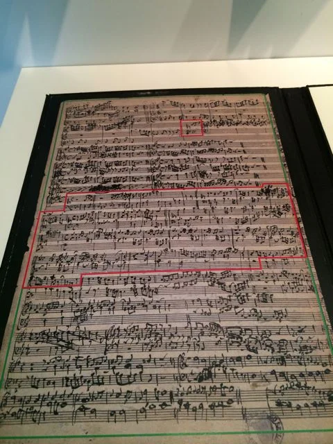 An absolutely priceless document—a counterpoint lesson with Bach and his son Wilhelm Friedemann. Bach's writing is inside the red box. W.F.'s exercise is in invertible counterpoint (melodies that work equally well when the top and bottom voices flip). It's quite good. But his dad's examples take things up a notch with counterpoint at double and half the speed—such a show-off!