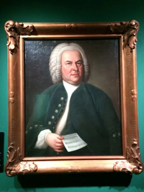 The famous Hausmann portrait of J.S. Bach. What is he holding?