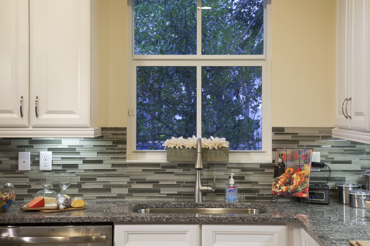 A glass tile back splash is a beautiful kitchen detail.