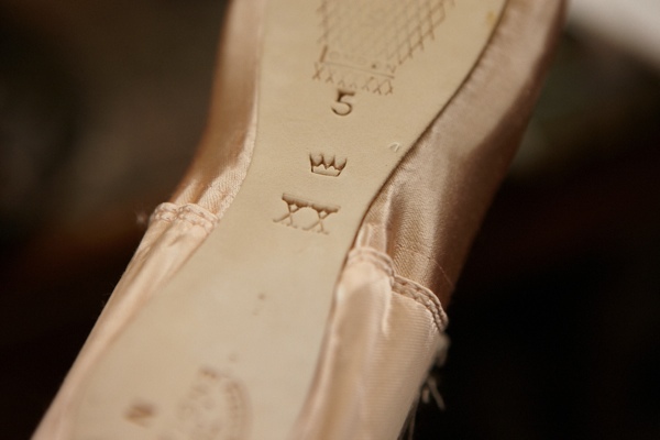  The maker’s mark of “Crown” upon the sole of one of his pointe-shoes. 