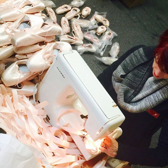 More than one thousand new pointe shoes being sewn for the Pointe Shoe Chandeliers