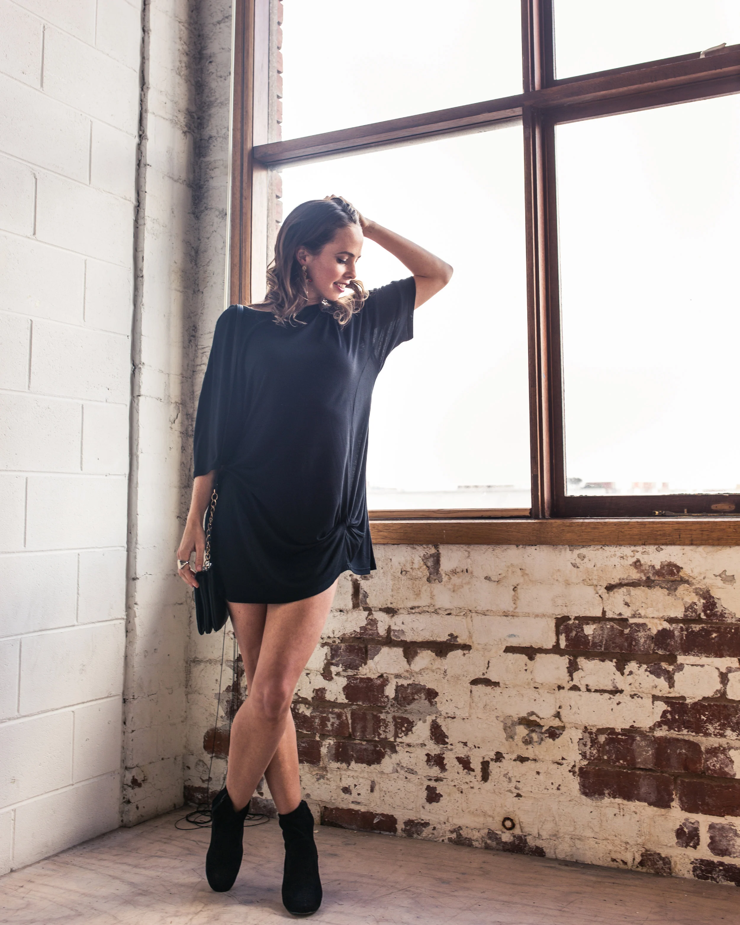 Lucy wears the Hailey Knot Tee from the Atelier Collection