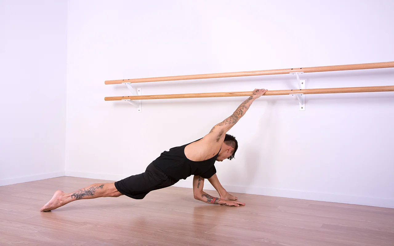 Brad wears the Men's Cut Away Singlet and Urban Short in Black