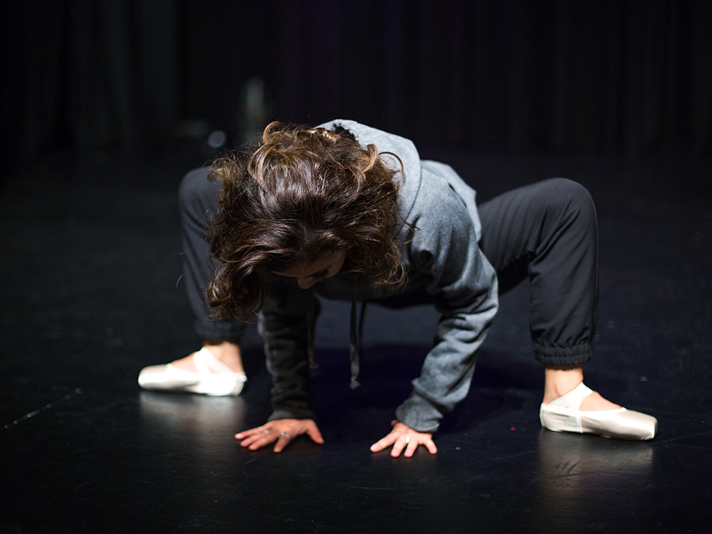 Chanel stretches pre-performance wearing Energetiks Lumina Pointe Shoes