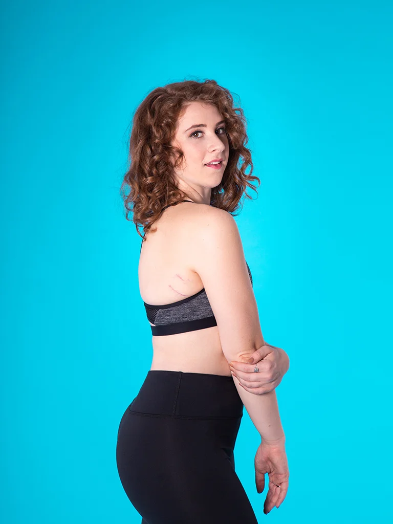 Devon wears the Harper Crop Top in Black with the Bailey 7/8 Legging in Black Subli