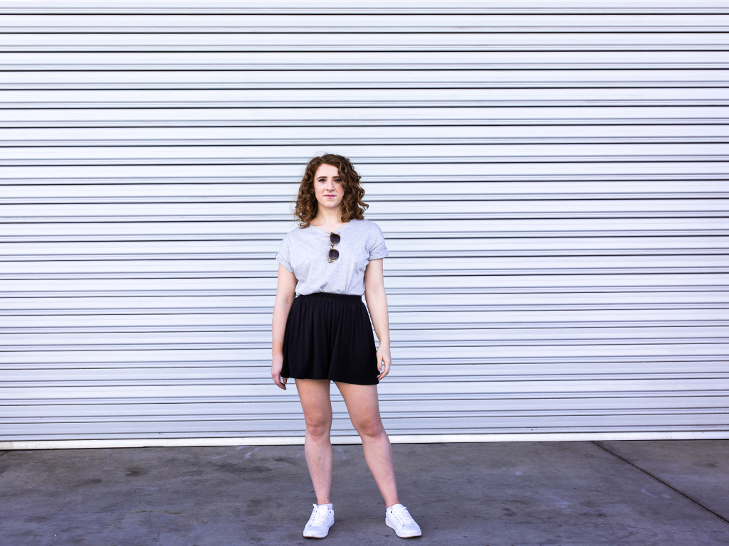 Devon wears the Grace Detailed Back Tee in Grey Marle and the Sadie Volume Short in Black from the Atelier Collection