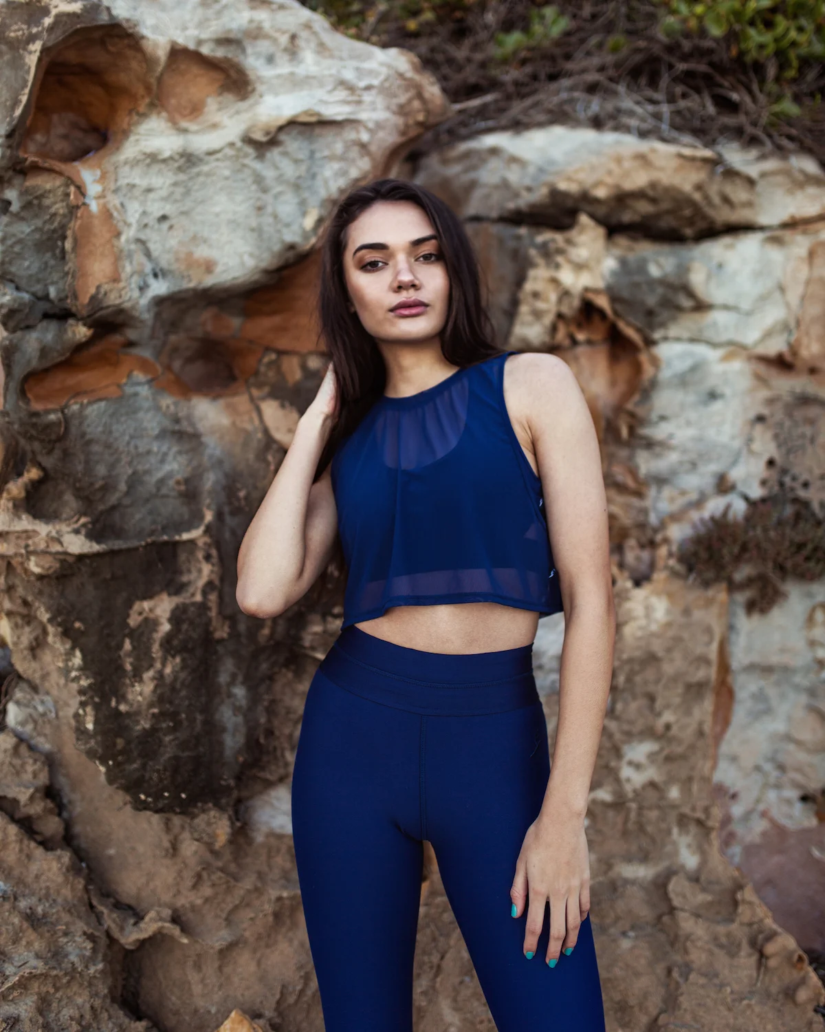 Portia wears the Lucy Crop Top in Midnight Blue, Lola Dance Crop in Midnight Mesh and Billie Legging in Midnight Blue