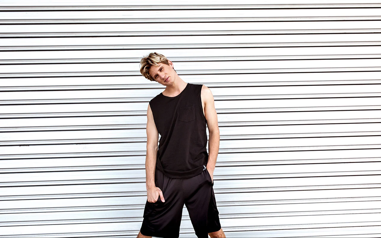 Luke wears the Brayden Tank and Urban Short