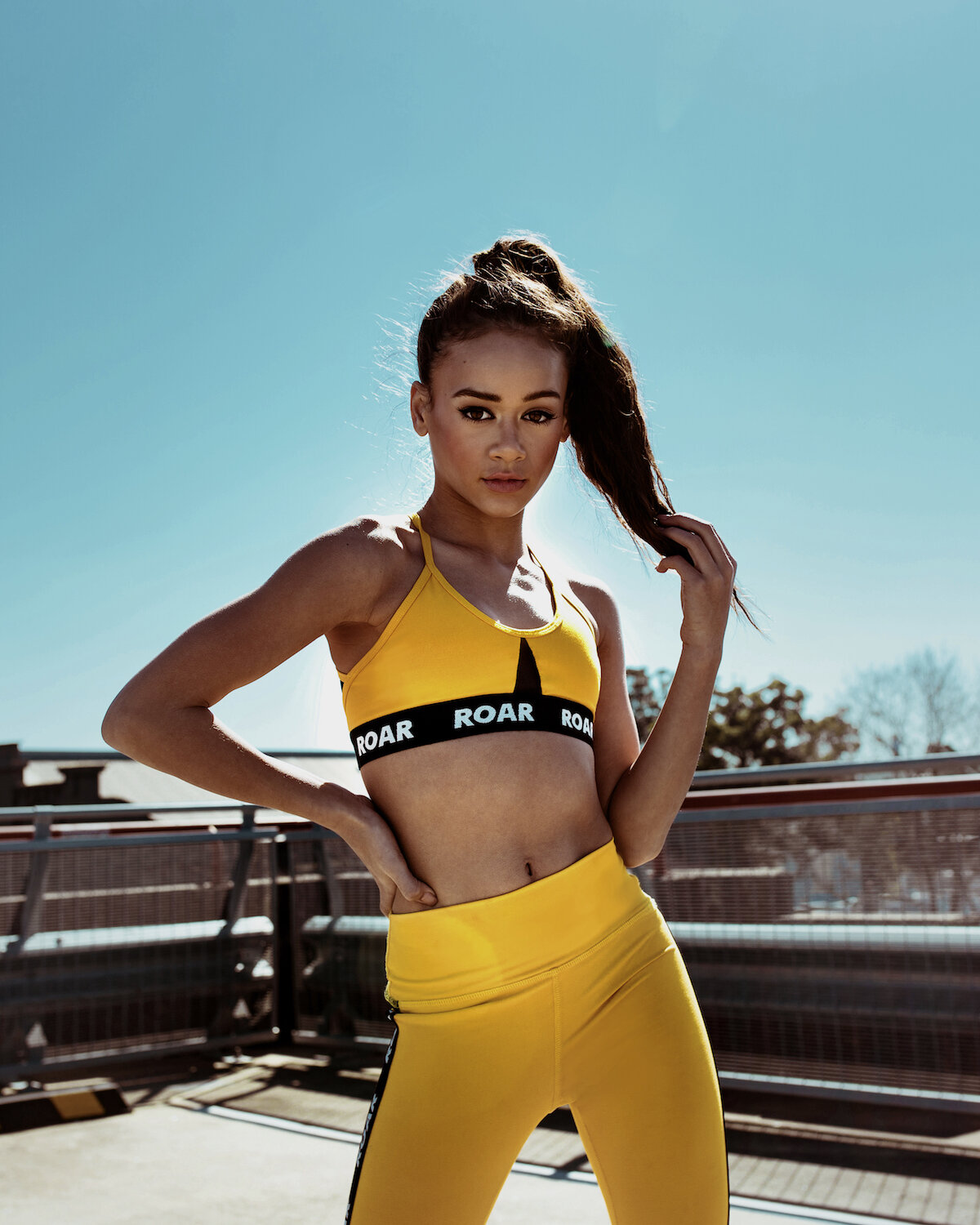  Mackenzie wears the Sloane Crop Top and Raven Track Tight 