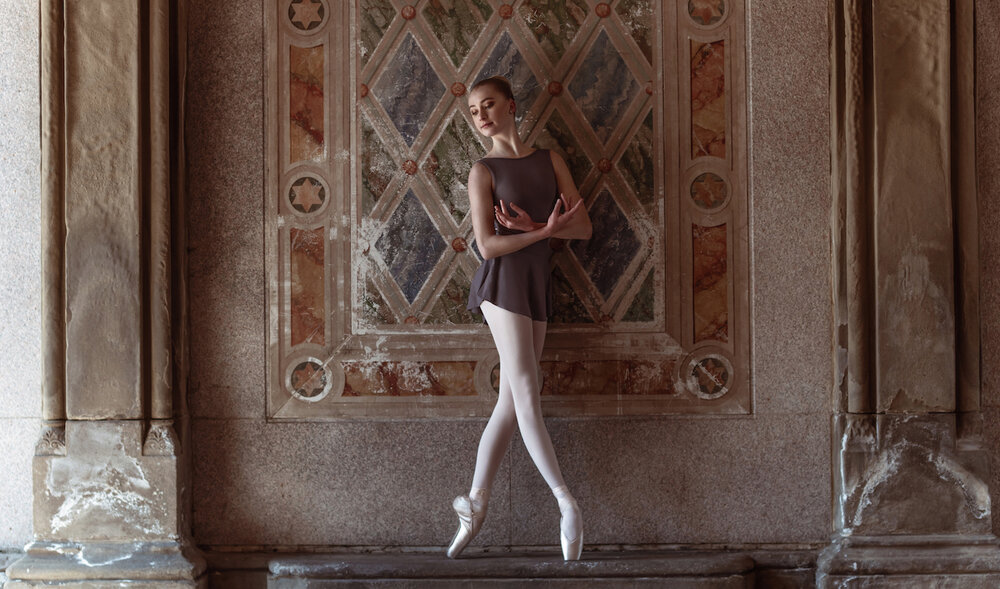Layla wears the  Natalie Leotard  and  Natalia Skirt  in the colour Slate