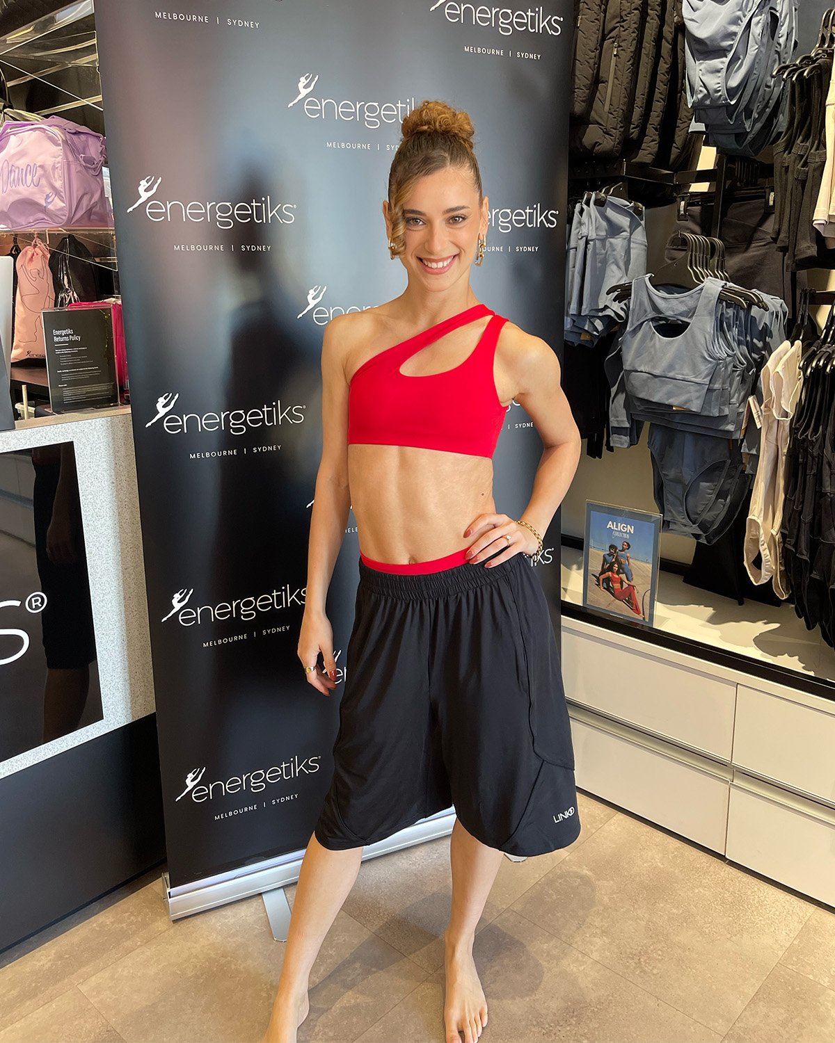 Felicia wears the Xenia Crop Top, Halley Bike Short, Linkd Urban Short 